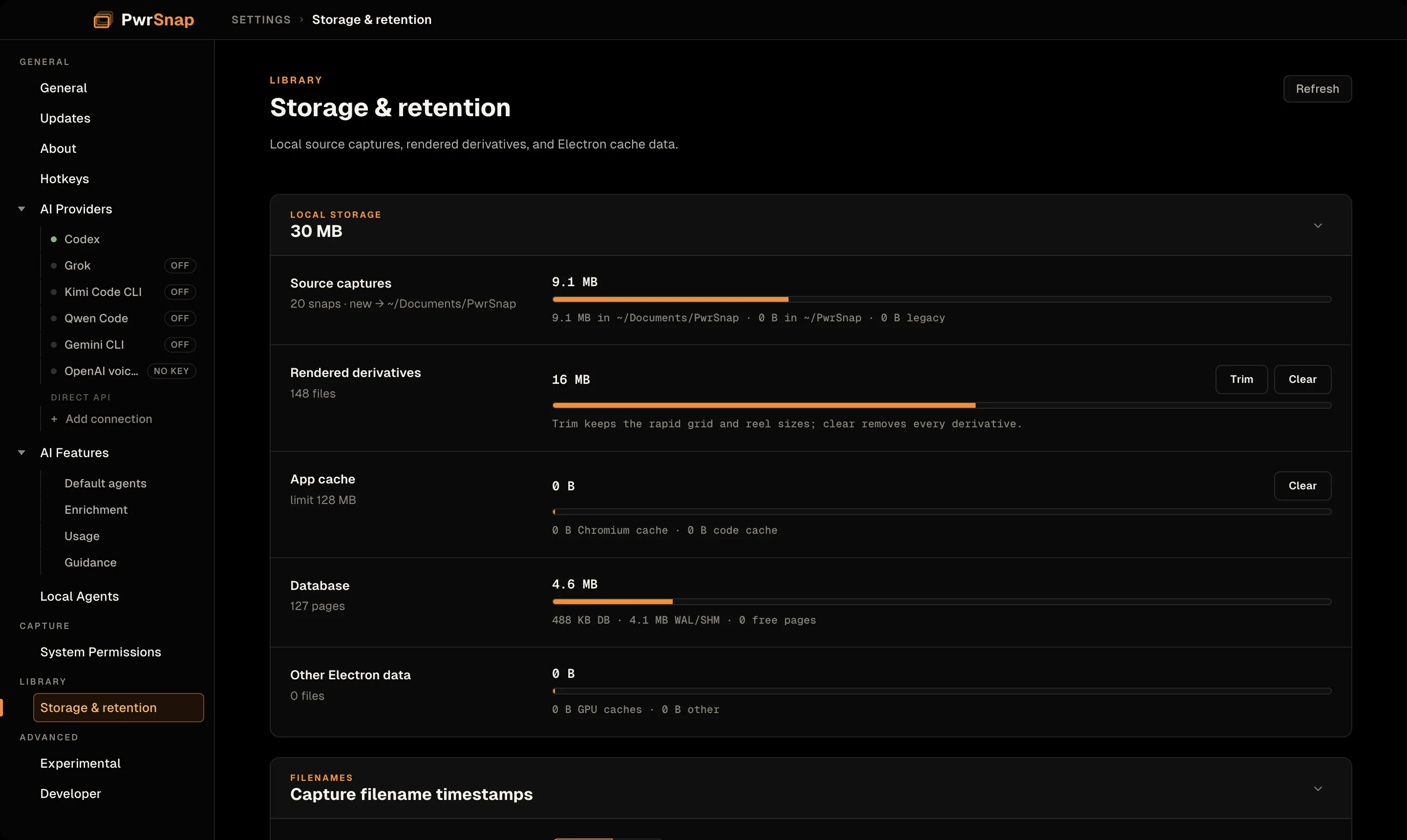 The Storage and retention page. A Local storage card totals 30 MB: Source captures 9.1 MB, 20 snaps, new captures going to ~/Documents/PwrSnap; Rendered derivatives 16 MB with Trim and Clear buttons; App cache with a Clear button; Database 4.6 MB; and Other Electron data. The Capture filename timestamps card begins below.